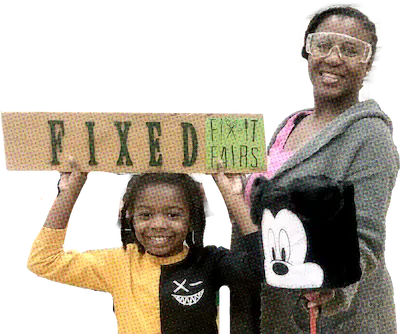 woman wearing safety goggles and holding a lamp next to a girl holding a sign that says fixed, fix it fairs